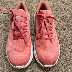 Woman’s pink Hoka one to one sneakers